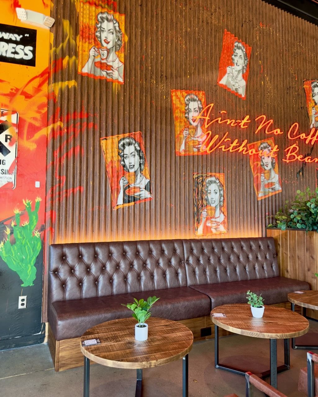 Mural by not.travis across corrugated steel at Black Sheep Coffee in Plano, Texas, 2024